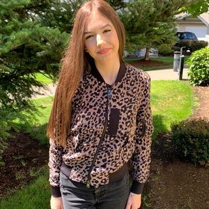 Blackish-pinkish-brownish silk jacket. Zipper front with pockets.